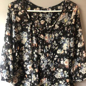 Sheer black polyester blouse, size medium.